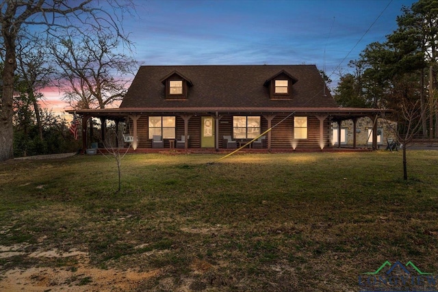 view of front of home with a lawn