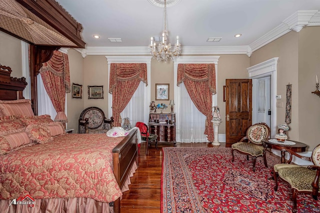 bedroom with an inviting chandelier, crown molding, and dark wood-type flooring