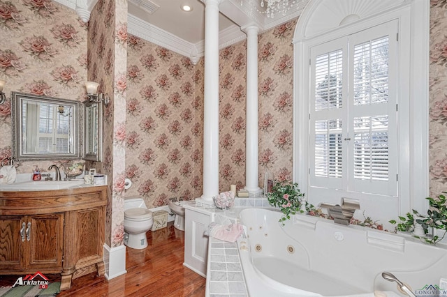 bathroom with vanity, crown molding, toilet, wood-type flooring, and decorative columns