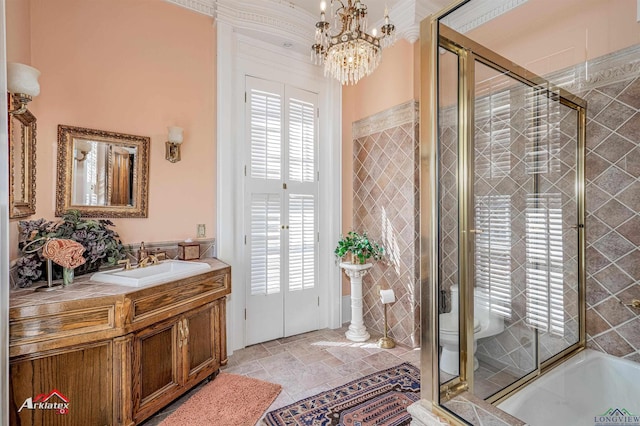 bathroom featuring vanity, a shower with shower door, and a chandelier