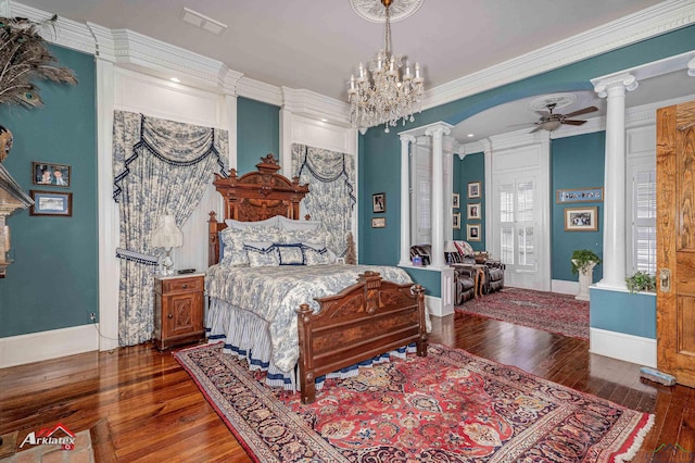 bedroom with dark hardwood / wood-style floors, ornate columns, and crown molding