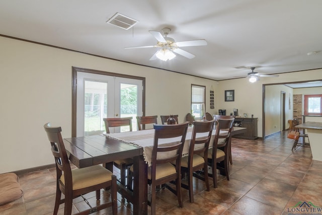 dining area featuring ceiling fan and french doors