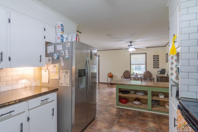 kitchen with electric range, ceiling fan, stainless steel refrigerator with ice dispenser, decorative backsplash, and white cabinets