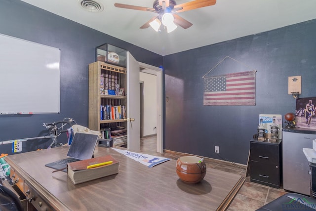 home office with ceiling fan and light tile patterned flooring