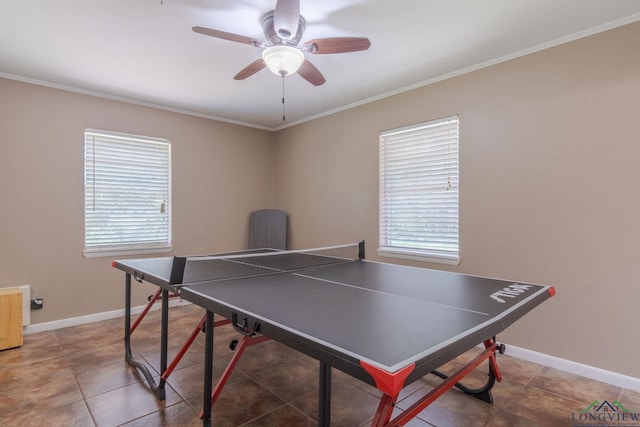 rec room featuring a wealth of natural light, ornamental molding, and ceiling fan