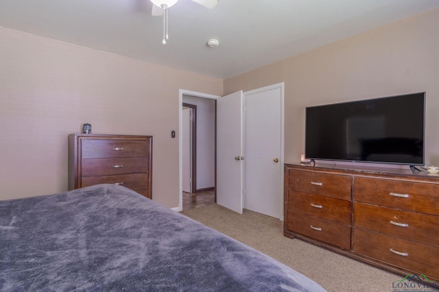 bedroom with light carpet and ceiling fan