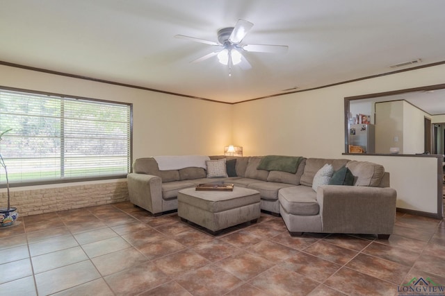 living room with ceiling fan and crown molding