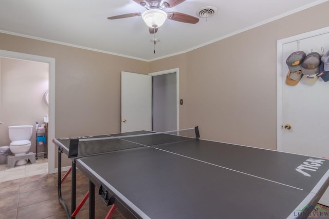 playroom featuring crown molding, tile patterned flooring, and ceiling fan