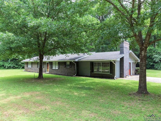 ranch-style house with a front lawn