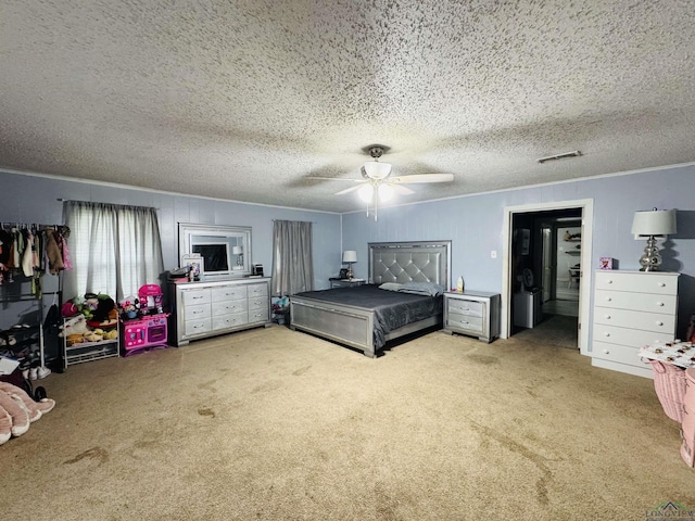 bedroom featuring ceiling fan, carpet floors, and a textured ceiling