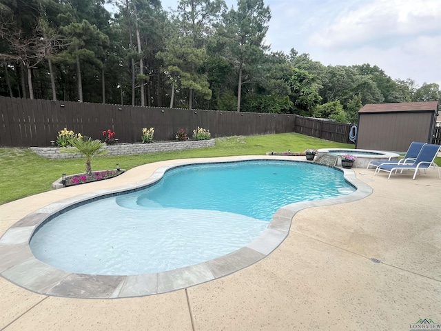 view of pool featuring a shed, an outdoor structure, a patio area, and a pool with connected hot tub