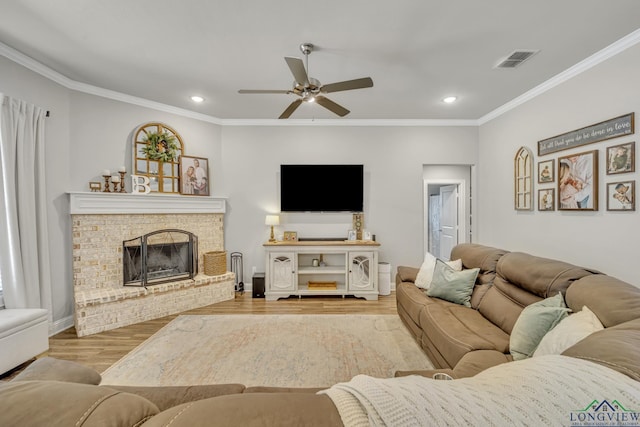 17182 Ironwood Dr, Flint, TX 75762 - living room with a ceiling fan, recessed lighting, wood finished floors, ornamental molding, and a fireplace