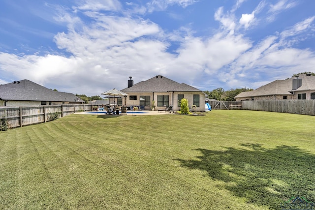 17182 Ironwood Dr, Flint, TX 75762 - rear view of property with a fenced backyard, a chimney, and a patio