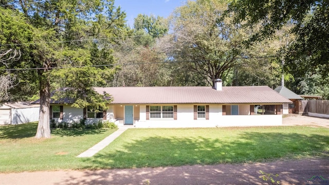 ranch-style house featuring a front lawn