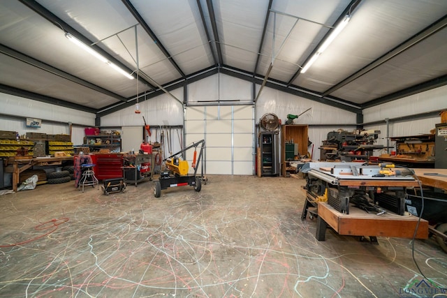 garage featuring a workshop area and metal wall