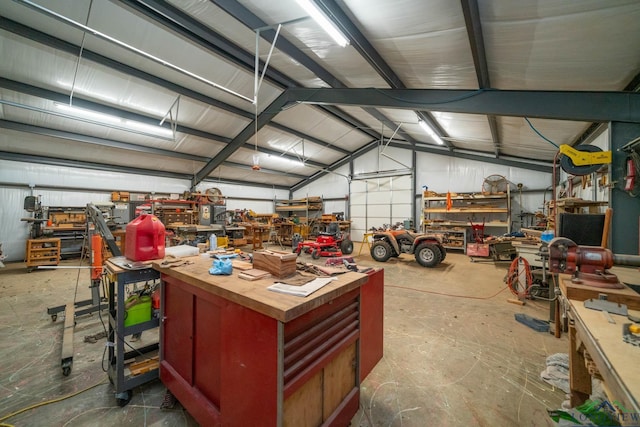 garage with a workshop area and metal wall