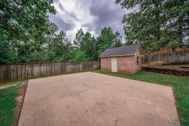 view of patio / terrace with a storage shed