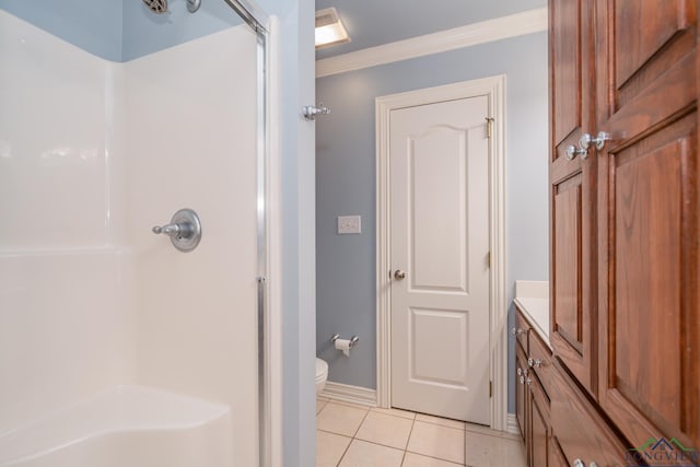 bathroom with tile patterned flooring, toilet, crown molding, and walk in shower