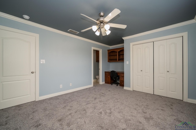 unfurnished bedroom with carpet flooring, ceiling fan, and crown molding