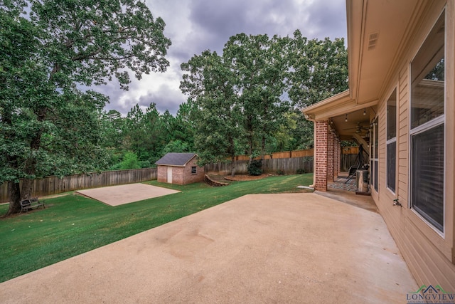 view of patio / terrace featuring a storage unit