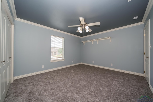 carpeted empty room with ceiling fan and crown molding