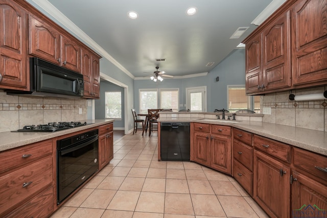 kitchen with ceiling fan, sink, tasteful backsplash, light tile patterned floors, and black appliances