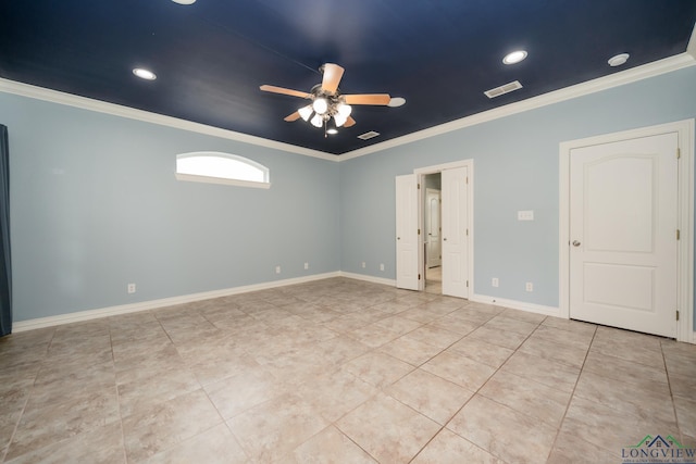 tiled spare room featuring ceiling fan and crown molding