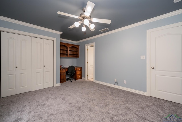 unfurnished bedroom featuring ceiling fan, light colored carpet, crown molding, and a closet