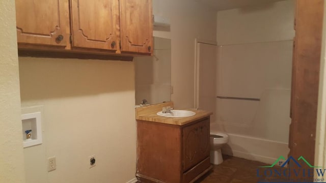 full bathroom featuring shower / bath combination, vanity, and toilet