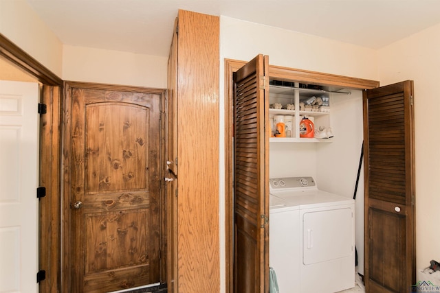 laundry area with separate washer and dryer