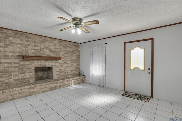 unfurnished living room with light tile patterned flooring, brick wall, a textured ceiling, and a fireplace