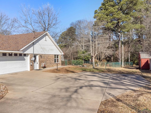 view of side of home featuring a garage