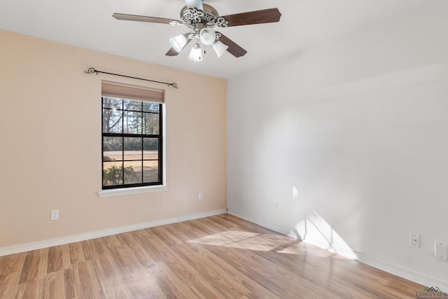 spare room with ceiling fan and light wood-type flooring