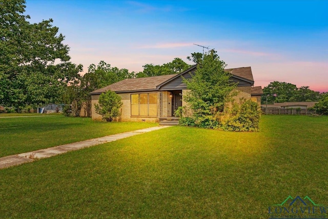 104 Mackinnon St, Mount Pleasant, TX 75455 - view of front of property featuring a front lawn and brick siding