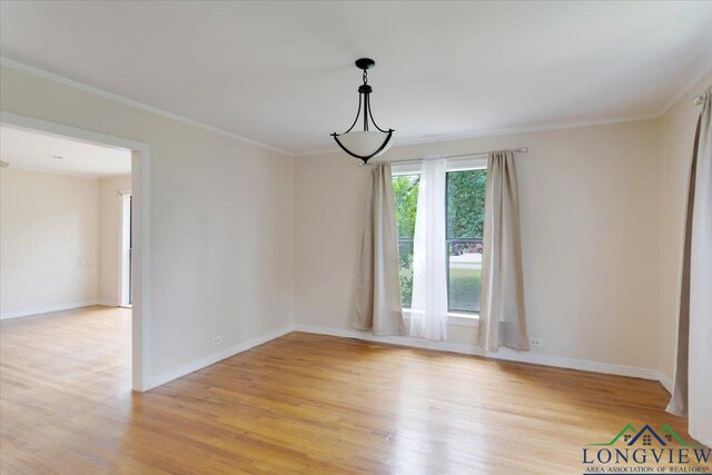 104 Mackinnon St, Mount Pleasant, TX 75455 - unfurnished room with light wood-style floors, baseboards, and crown molding