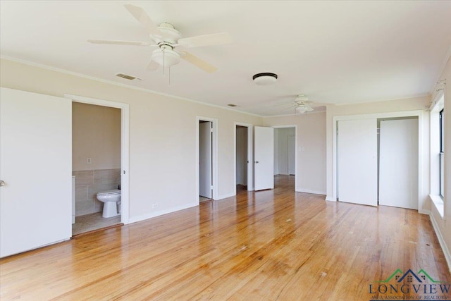 104 Mackinnon St, Mount Pleasant, TX 75455 - unfurnished bedroom with light wood-type flooring, ornamental molding, a closet, a ceiling fan, and ensuite bathroom