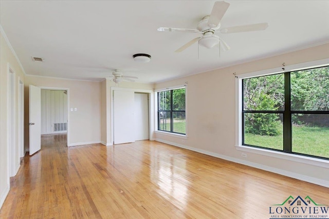 104 Mackinnon St, Mount Pleasant, TX 75455 - empty room with a ceiling fan, light wood-style floors, baseboards, and ornamental molding