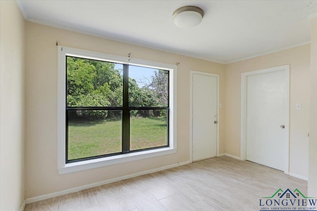 104 Mackinnon St, Mount Pleasant, TX 75455 - empty room with crown molding and baseboards