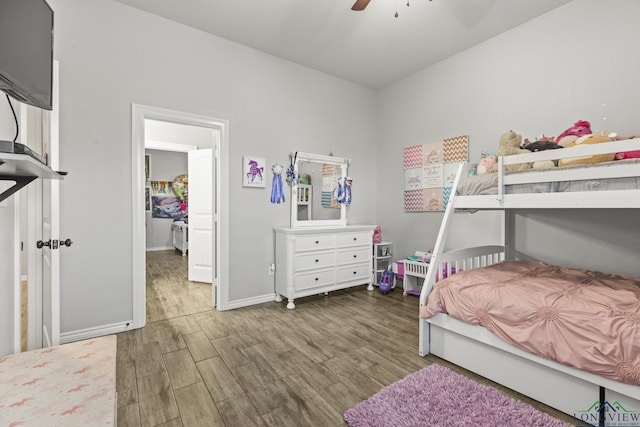 bedroom featuring dark hardwood / wood-style flooring and ceiling fan