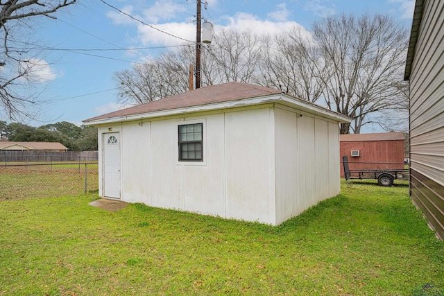 view of outdoor structure with a lawn