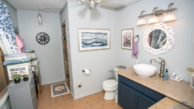 bathroom with walk in shower, vanity, a textured ceiling, tile patterned flooring, and toilet