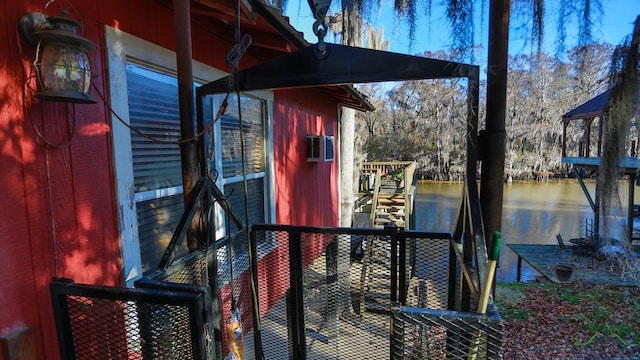 deck featuring a water view and a boat dock