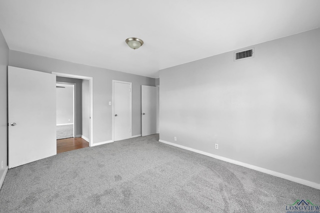 202 W Rocky Creek Rd, Houston, TX 77076 - unfurnished bedroom featuring carpet flooring and baseboards