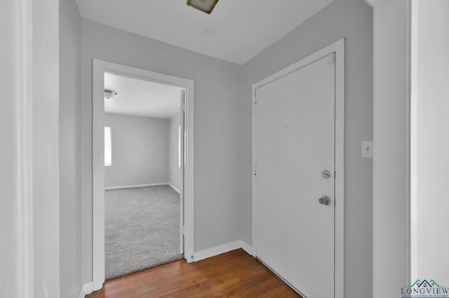 202 W Rocky Creek Rd, Houston, TX 77076 - corridor with dark wood finished floors and baseboards
