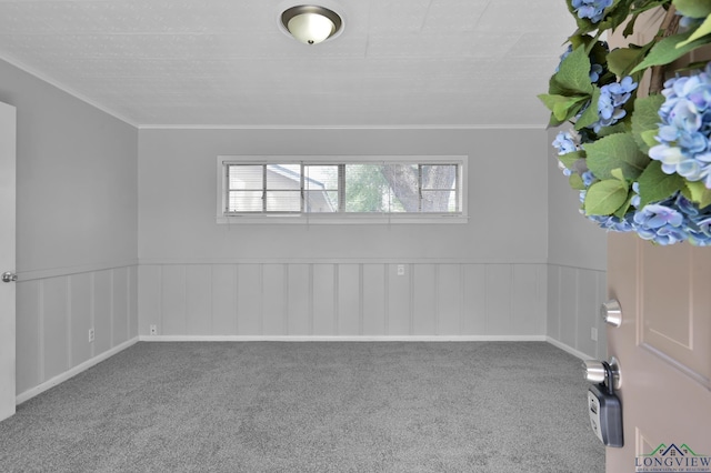 202 W Rocky Creek Rd, Houston, TX 77076 - carpeted empty room featuring crown molding and a wainscoted wall