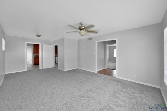 202 W Rocky Creek Rd, Houston, TX 77076 - carpeted empty room with baseboards and ceiling fan