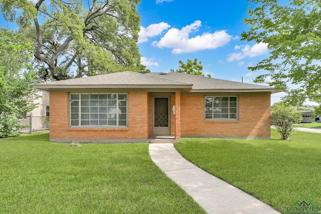 202 W Rocky Creek Rd, Houston, TX 77076 - view of front of property featuring brick siding and a shingled roof