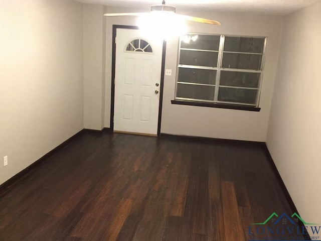 interior space featuring dark hardwood / wood-style floors and ceiling fan