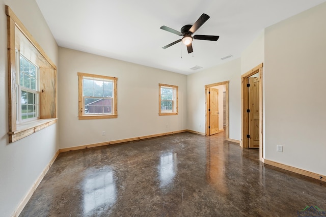 9089 Raspberry Ave, Frankston, TX 75763 - unfurnished bedroom with finished concrete floors, baseboards, and a ceiling fan