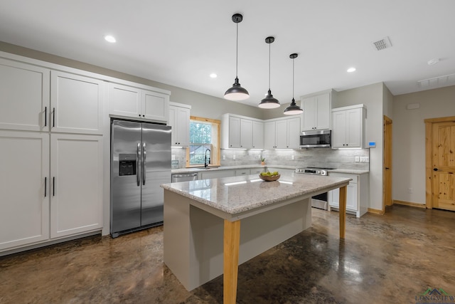 9089 Raspberry Ave, Frankston, TX 75763 - kitchen featuring appliances with stainless steel finishes, a sink, tasteful backsplash, concrete flooring, and white cabinets